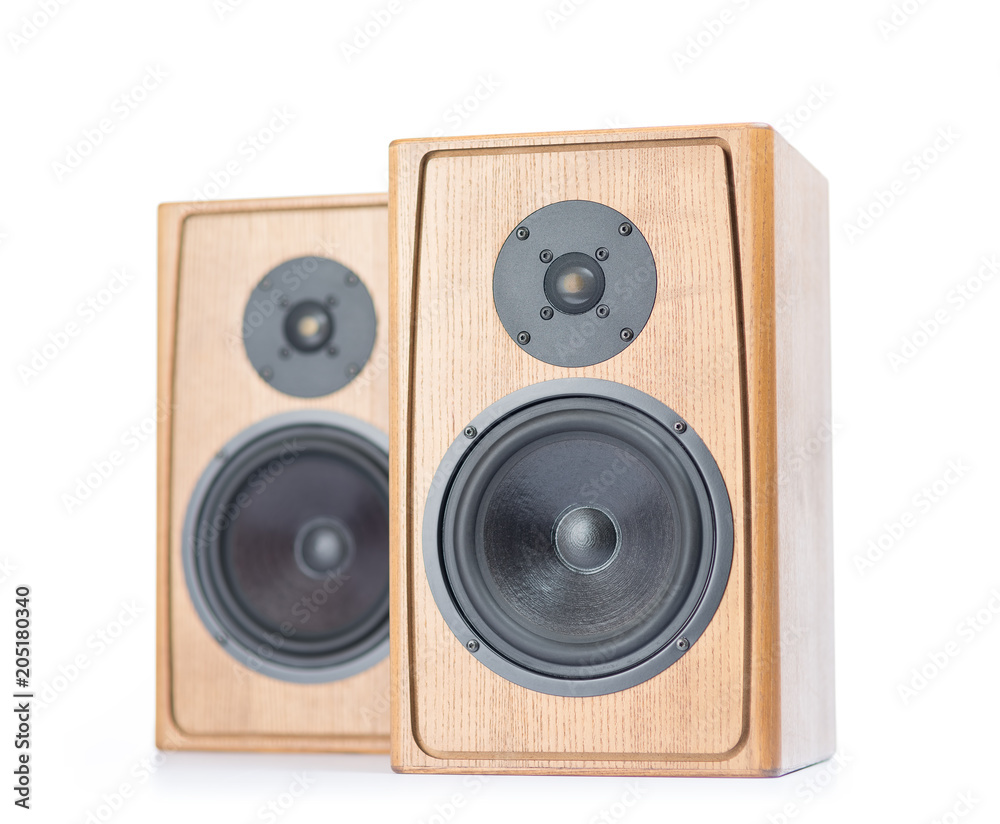 Two wooden speakers isolated on white background. Two wooden speakers isolated on white background.