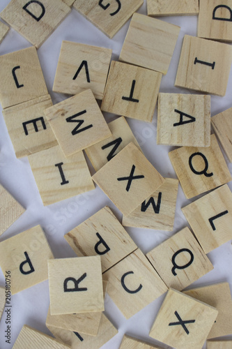 Wooden tiles with letters on an isolated white background