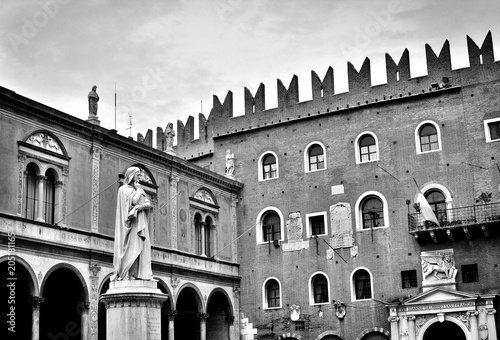 The marble statue of the famous medieval writer and poet Dante Alighieri in Verona, Italy; photos in antique black and white style photo