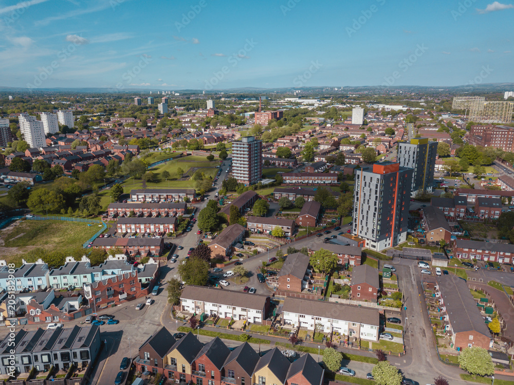 Obraz premium Aerial city centre drone above buildings british manchester skyline summer blue sky ancoats northern quarter