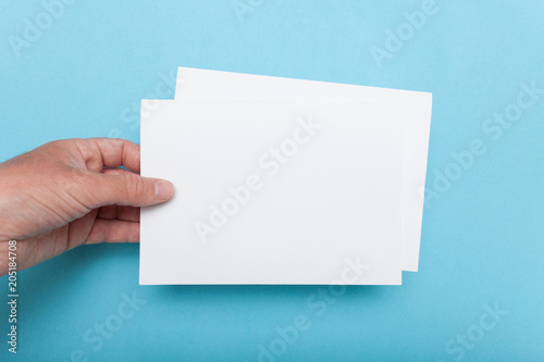 A5 Flyer mockup in hand, paper blank template brochure. photo