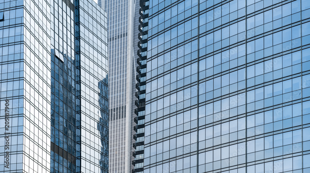 modern office building with reflection in windows of building