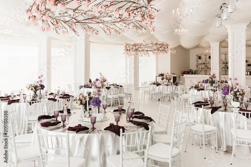Photography Photo of beautiful white wedding hall with big tables isolated