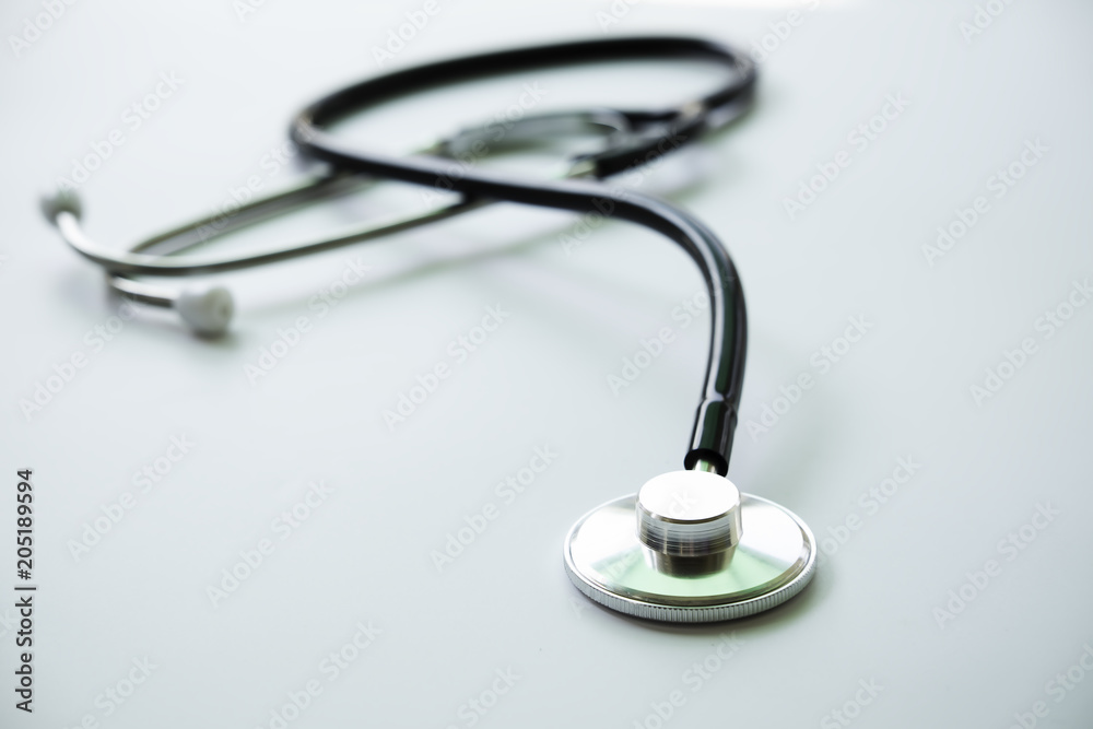Medical concept image. stethoscope on white table.Stethoscope seen from above. A lot copy space around the product. Top view. Horizontal image. Medical concept image. stethoscope on white table.Stethoscope seen from above. A lot copy space around the product. Top view. Horizontal image.