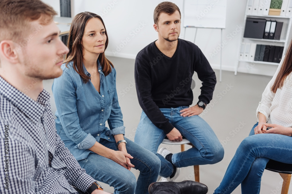 Group of people attending a meeting Group of people attending a meeting