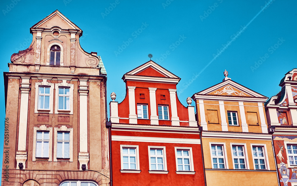 Vintage stylized old houses facades at Poznan Old Market Square, Poland.