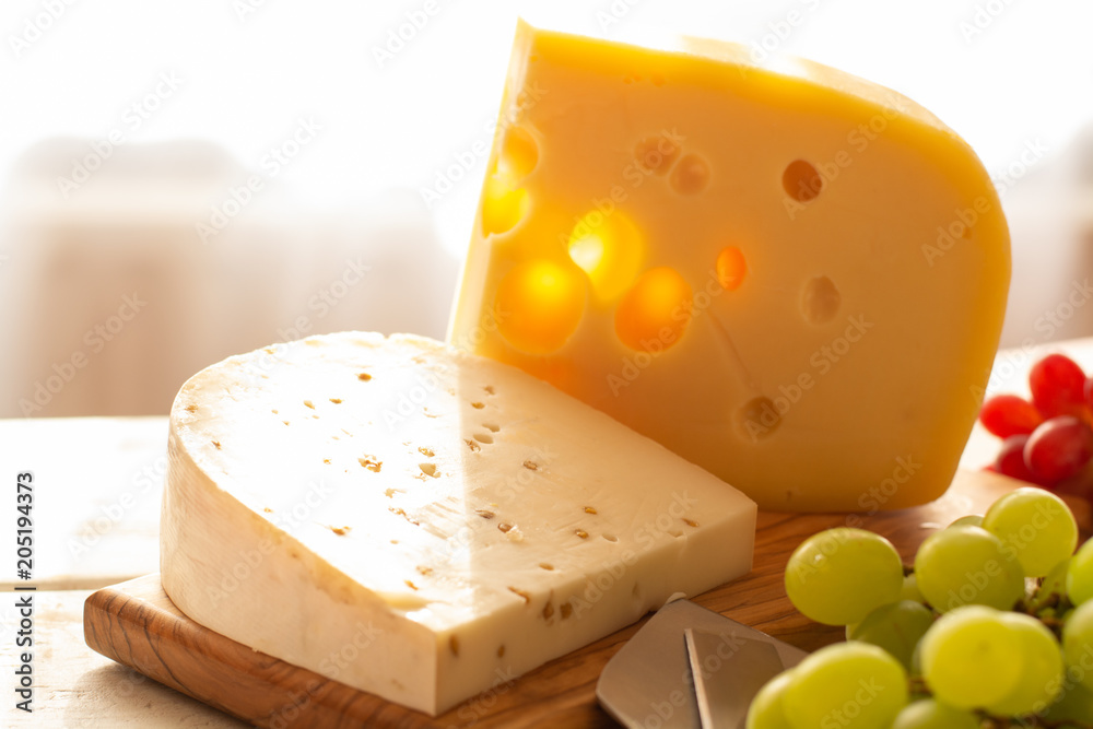 Dutch hard cheese Maasdam or Emmentaler, cheese with holes
