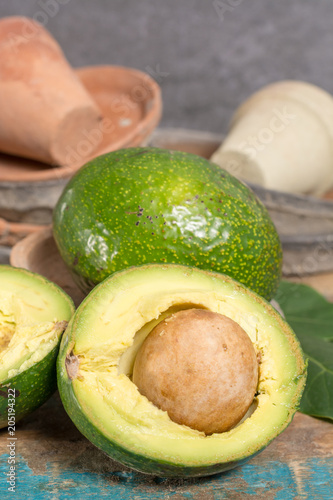 Green ripe tasty Ryan avocado with big round seed, ready to eat. photo