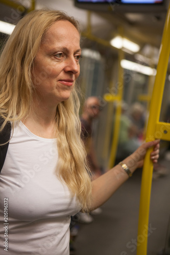 Close up of happy woman in a train (subway)