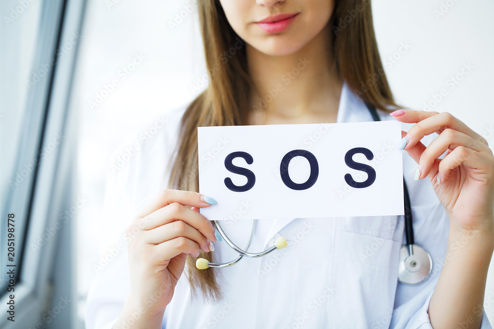 Health Care. Doctor Holding a Card With Symbol HELP, Medical Concept