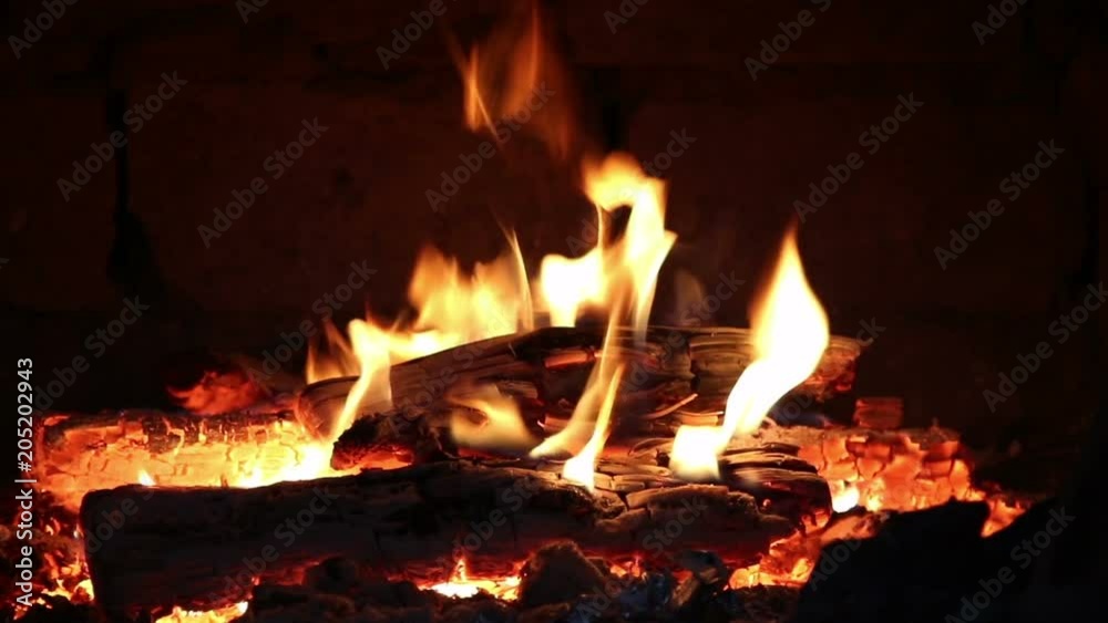 Hot coals and fire flames in fireplace, bonfire close-up. Hot coals and fire flames in fireplace, bonfire close-up.