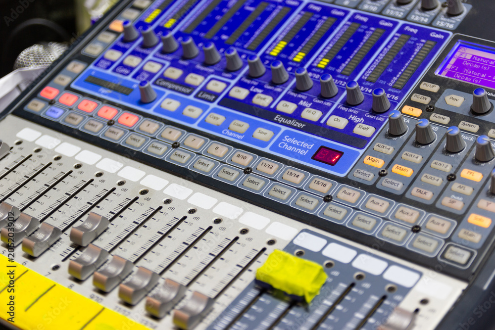 Closeup Mixing Console of a big HiFi system The audio equipment, a control panel of digital studio mixer. Closeup Mixing Console of a big HiFi system The audio equipment, a control panel of digital studio mixer.