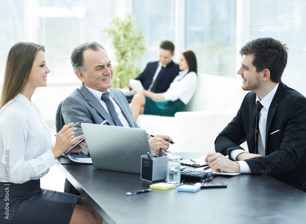 client talking with the staff at the Desk in the office client talking with the staff at the Desk in the office