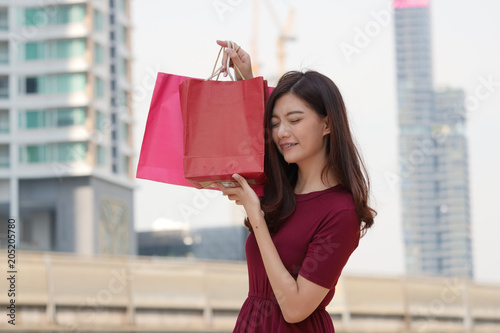  Happy Young Asian woman with Shopping bag .