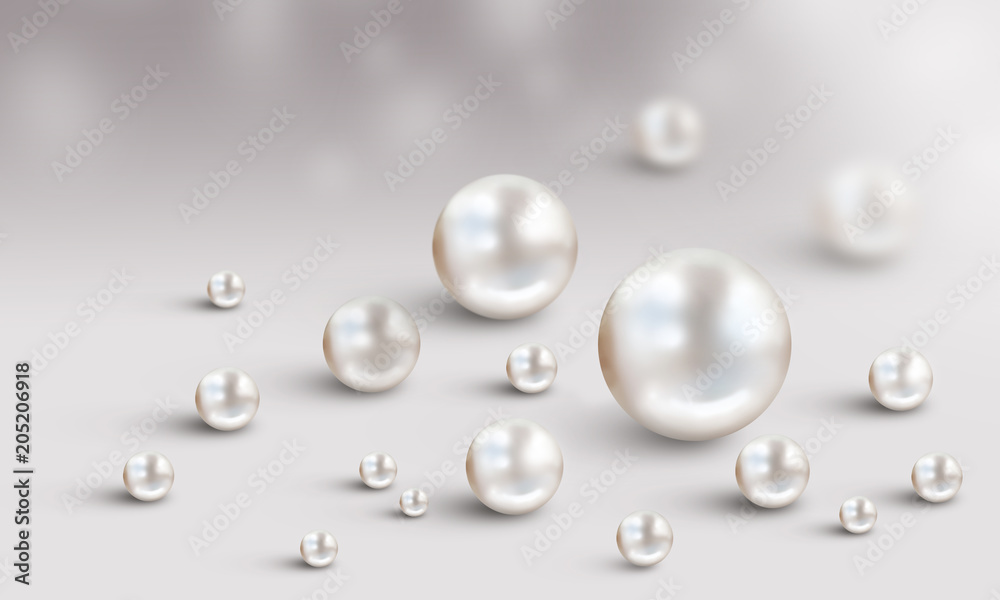 Many small and big white pearls on white and grey bokeh background
