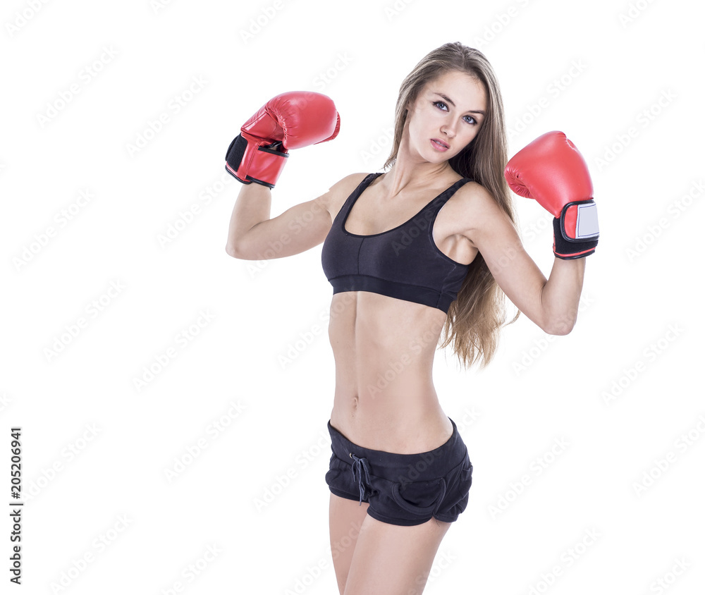 concept of purpose : portrait of young sporty woman in Boxing gloves