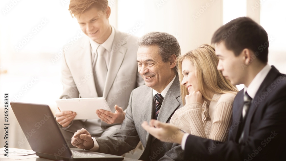 serious business team with tablet computers, documents having discussion in office serious business team with tablet computers, documents having discussion in office