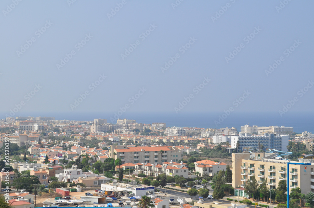 view of the city and the sea from the hill