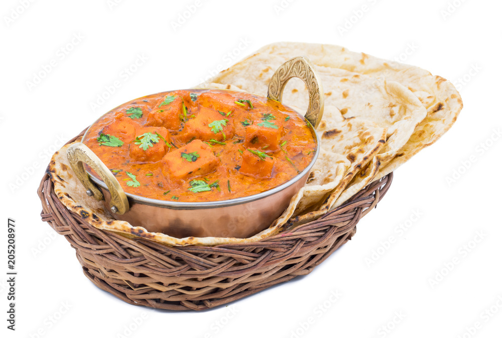 Indian Delicious Cuisine Paneer Tikka Masala With Tandoori Chapati Also Called Paneer Butter Masala is an Indian Dish of Marinated Paneer Cheese Served in a Spiced Gravy isolated on White Background