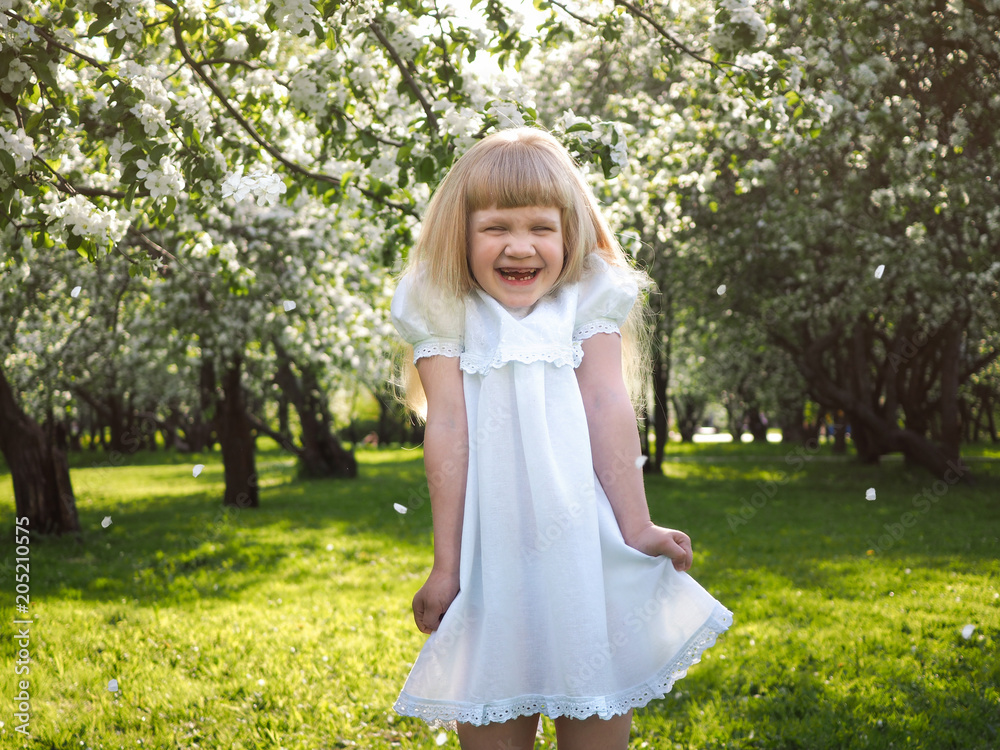 Very emotional portrait of a little girl. Funny child laughs happily Very emotional portrait of a little girl. Funny child laughs happily