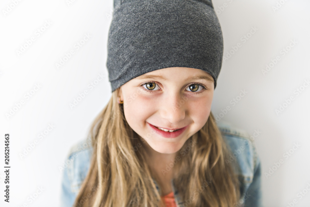 Portrait of a little girl. Studio photography of girl have toque on head Portrait of a little girl. Studio photography of girl have toque on head
