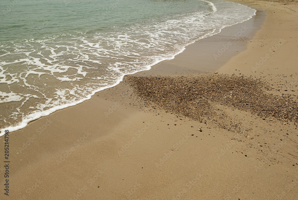 Shore of the beach where you can see foam on the sand. Summer. Shore of the beach where you can see foam on the sand. Summer.