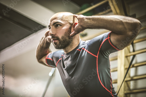 Close up image of young men exercise.