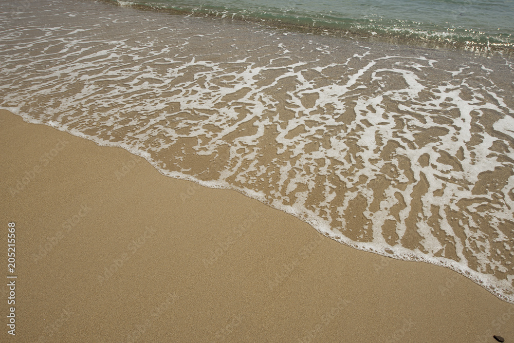 Shore of the beach where you can see foam on the sand. Summer. Shore of the beach where you can see foam on the sand. Summer.