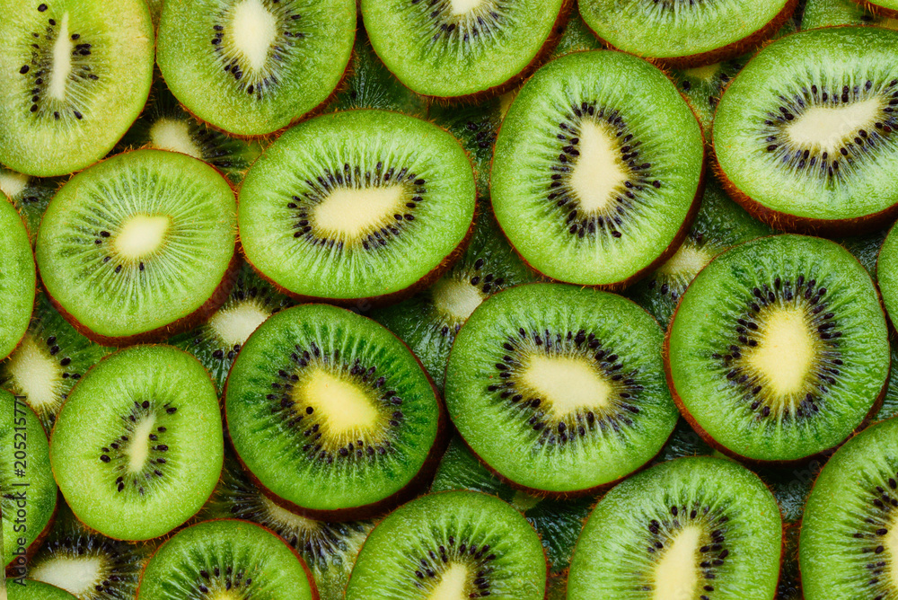 top view of heap of sliced kiwi as textured background