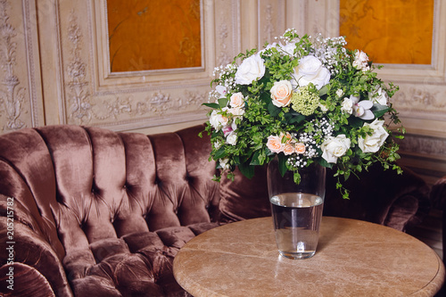 Bouquet of white roses on marble table