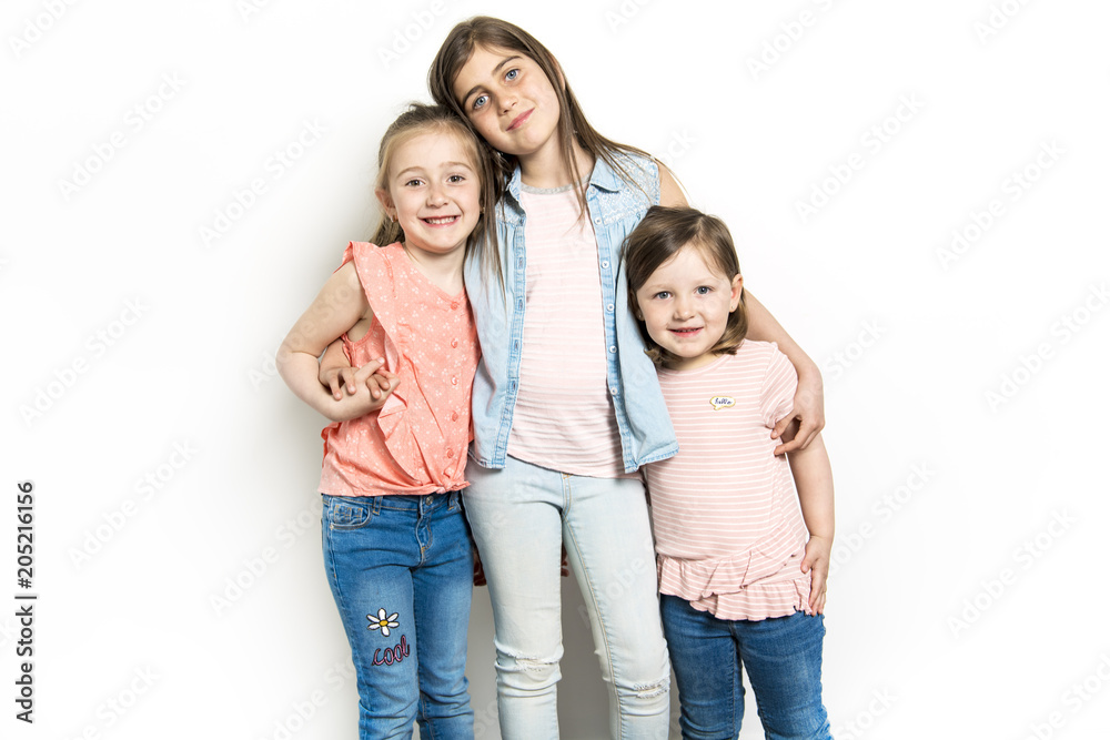 Sisters portrait in studio white background Sisters portrait in studio white background