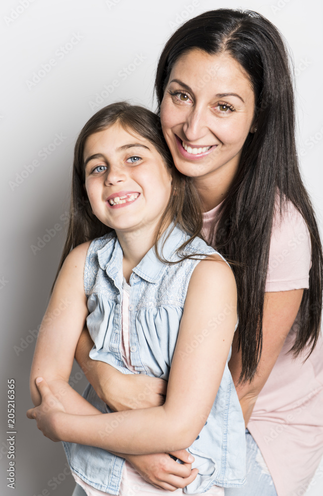 pretty mother standing with her cute daughter pretty mother standing with her cute daughter
