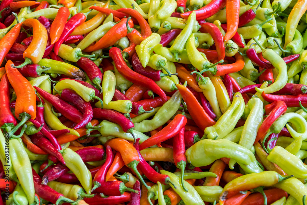 Variety of red, green and yellow hot pepper sold on a market Variety of red, green and yellow hot pepper sold on a market