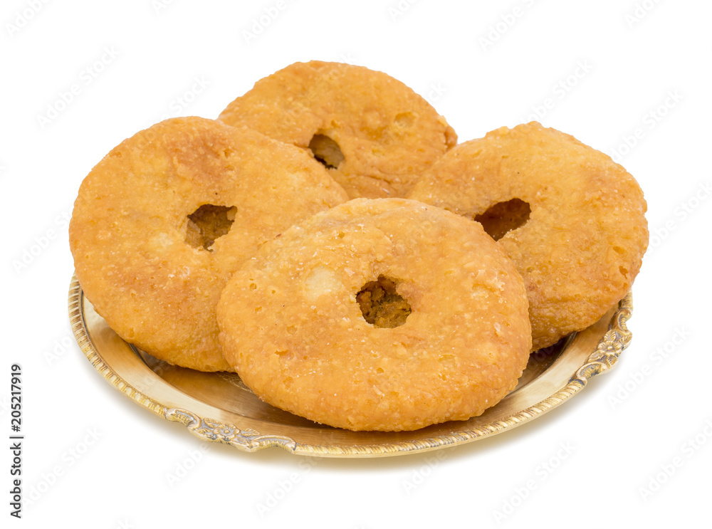 Indian Traditional Sweet Kachori Also Know As Mawa Kachori, Kachauri or Kachodi, Stuffed Kachori With Condensed Milk, Cheese and Dry Fruits And Served With Sugar Syrup isolated on White Background Indian Traditional Sweet Kachori Also Know As Mawa Kachori, Kachauri or Kachodi, Stuffed Kachori With Condensed Milk, Cheese and Dry Fruits And Served With Sugar Syrup isolated on White Background