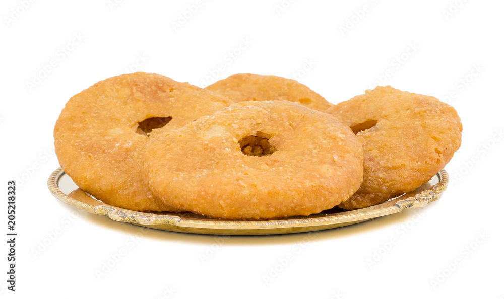 Indian Traditional Sweet Kachori Also Know As Mawa Kachori, Kachauri or Kachodi, Stuffed Kachori With Condensed Milk, Cheese and Dry Fruits And Served With Sugar Syrup isolated on White Background