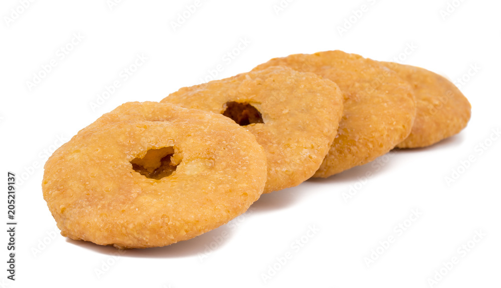 Indian Traditional Sweet Kachori Also Know As Mawa Kachori, Kachauri or Kachodi, Stuffed Kachori With Condensed Milk, Cheese and Dry Fruits And Served With Sugar Syrup isolated on White Background