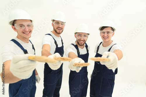 group of construction workers .isolated on white