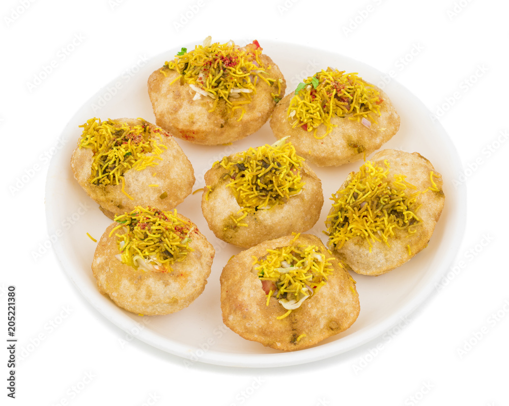 Indian Spicy Chaat Item Sev Puri Stuffed With Potato, Sev Namkeen, Coriander, Chutney isolated on White Background. It is a Most Popular Snack of Mumbai, Maharashtra Indian Spicy Chaat Item Sev Puri Stuffed With Potato, Sev Namkeen, Coriander, Chutney isolated on White Background. It is a Most Popular Snack of Mumbai, Maharashtra