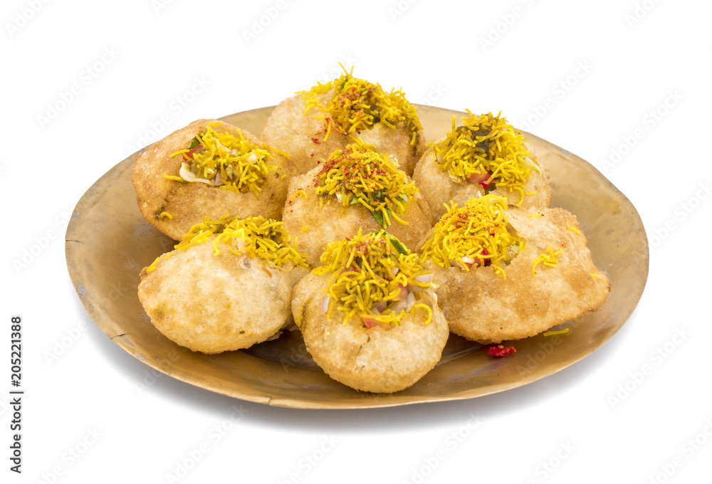 Indian Spicy Chaat Item Sev Puri Stuffed With Potato, Sev Namkeen, Coriander, Chutney isolated on White Background. It is a Most Popular Snack of Mumbai, Maharashtra Indian Spicy Chaat Item Sev Puri Stuffed With Potato, Sev Namkeen, Coriander, Chutney isolated on White Background. It is a Most Popular Snack of Mumbai, Maharashtra