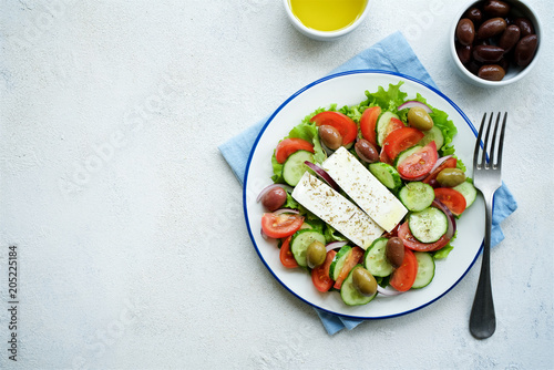 Traditional Greek salad. Light and healthy food. White food background