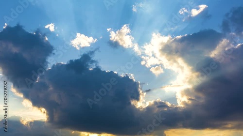 sun breaking through dramatic cloudscape time lapse