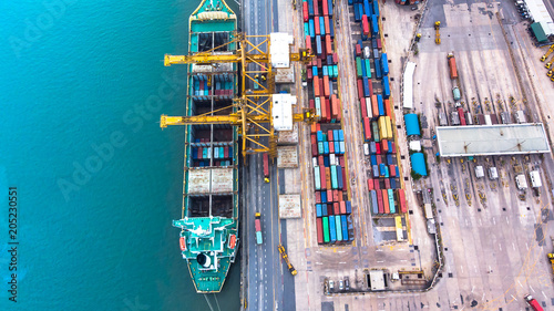 Aerial view from flying drone of shipping and freight import of goods and freight export and delivery to the international port. Water transport concept.
