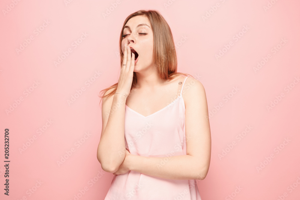 Beautiful bored woman bored isolated on pink background Beautiful bored woman bored isolated on pink background