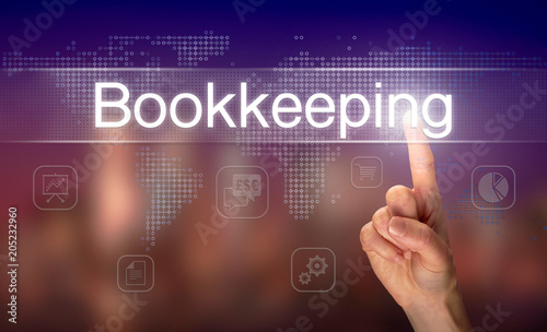A hand selecting a Bookkeeping business concept on a clear screen with a colorful blurred background.