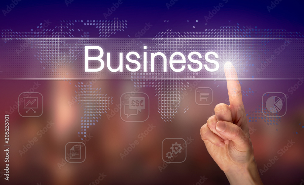 A hand selecting a Business concept on a clear screen with a colorful blurred background. A hand selecting a Business concept on a clear screen with a colorful blurred background.