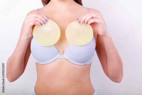 girl tries on breast implants photo
