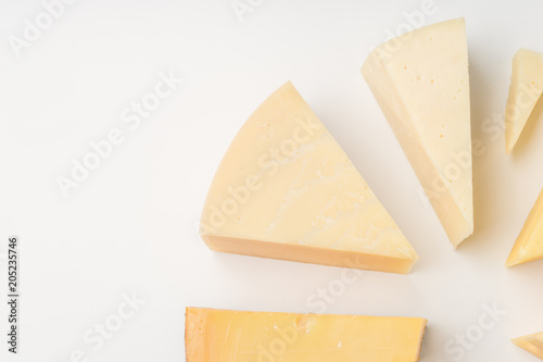 Different types of cheese on white background