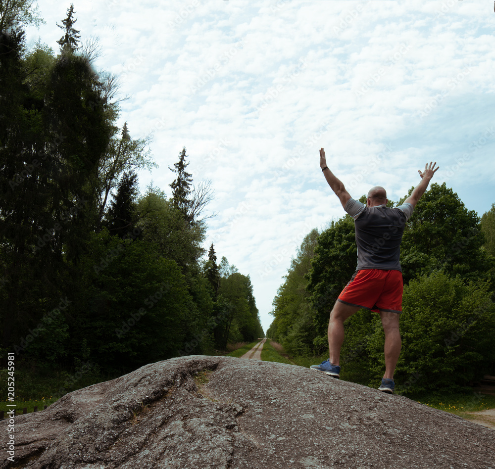 man on the top of the hill