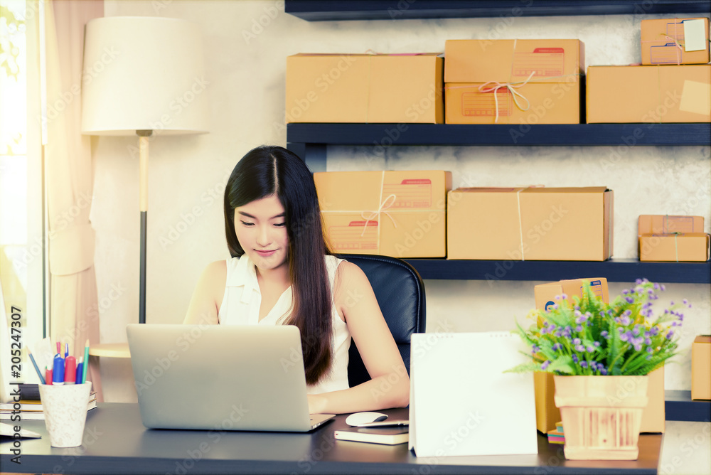 Asian charming beautiful girl entrepreneur use laptop for working or surf internet in modern working room. entrepreneurial self employed business concept. Asian charming beautiful girl entrepreneur use laptop for working or surf internet in modern working room. entrepreneurial self employed business concept.