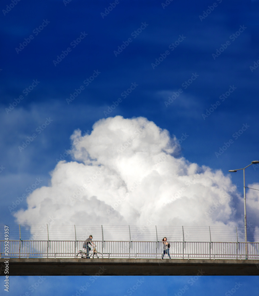 People are walking on clouds. The bridge which is near the sky.